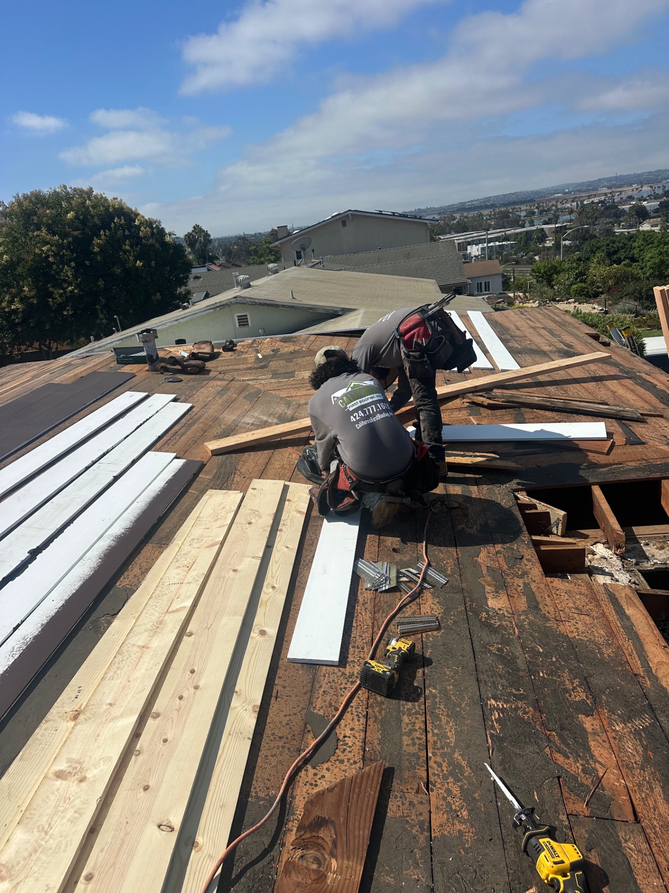 California First Roofing installers replacing skip sheathing and decking boards