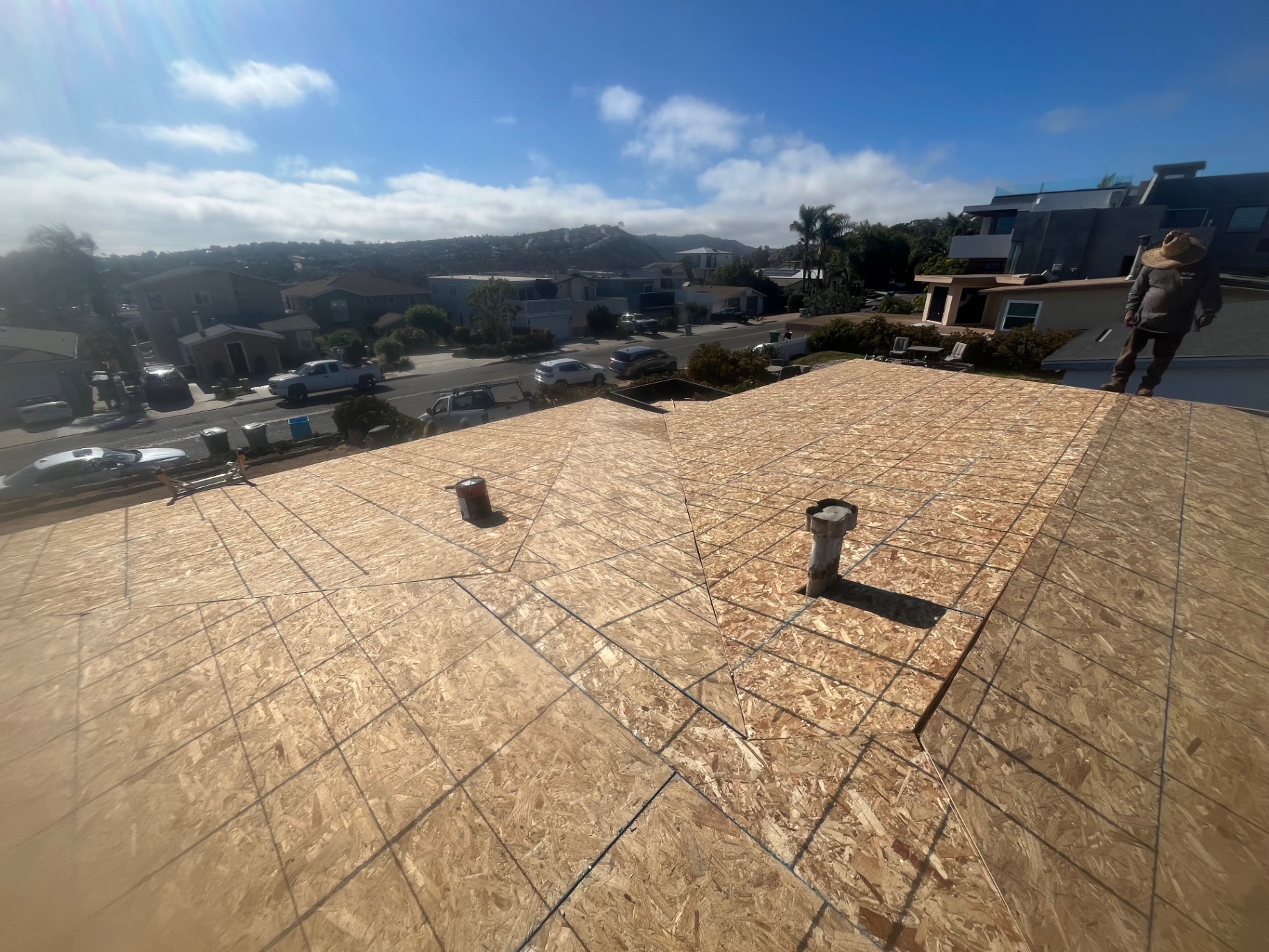 California First Roofing crew member overseeing a re-roof in Los Angeles