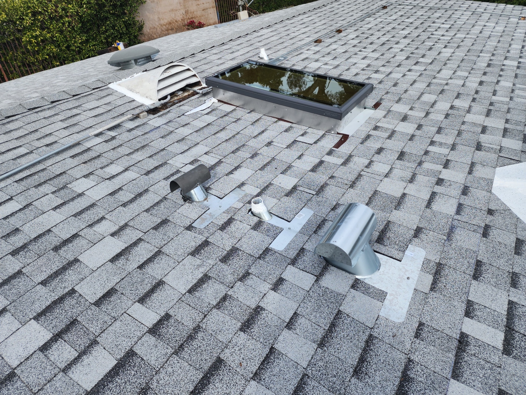 New shingle roof with skylight, vents, and precision flashing in Los Angeles