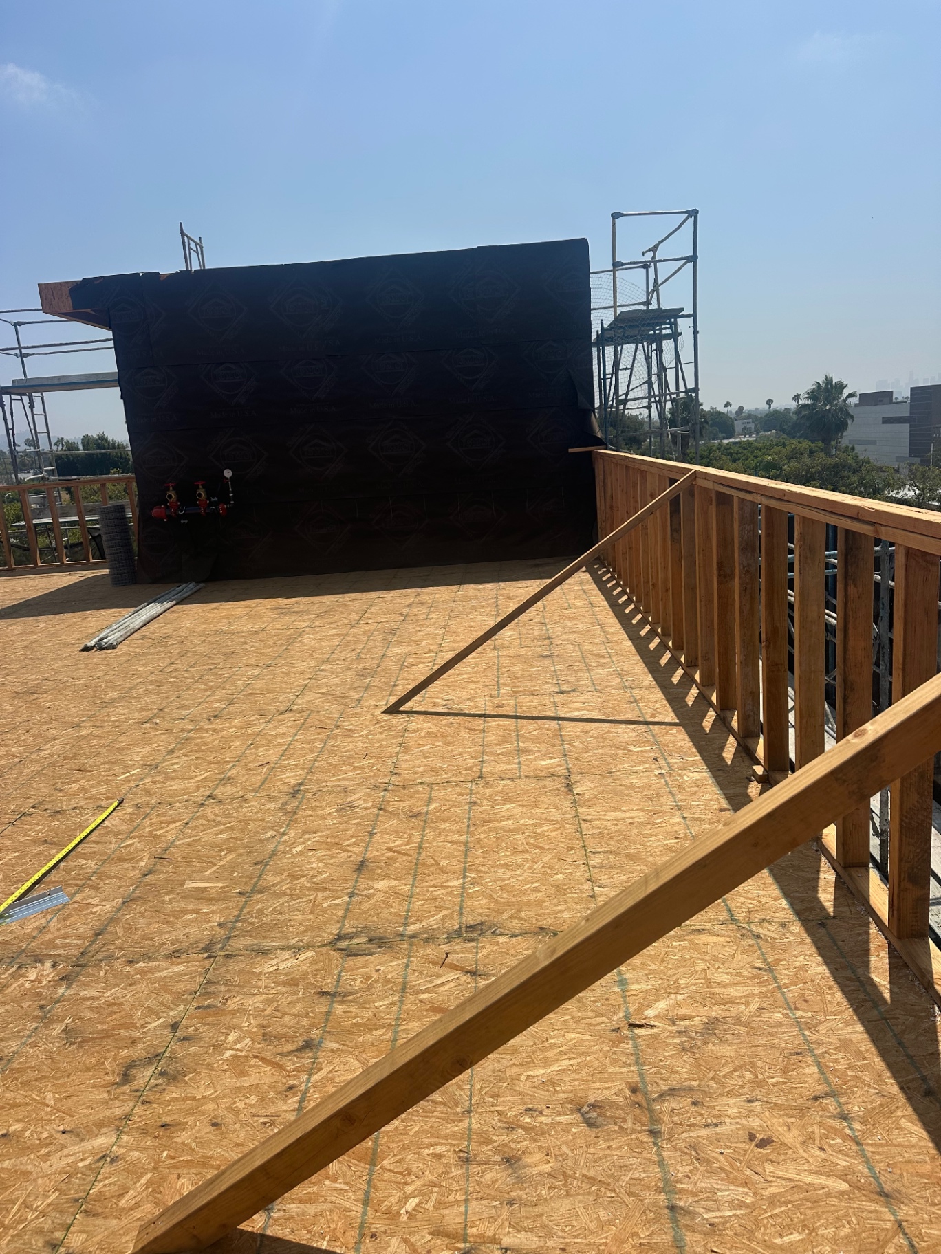 Modified bitumen wall flashing and OSB decking on an LA rooftop project