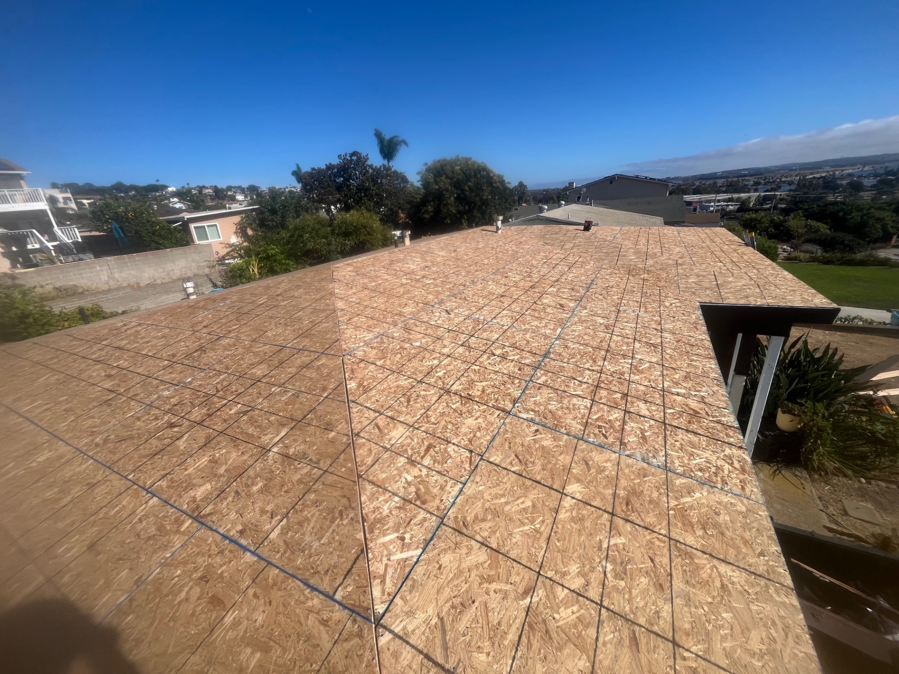 Clean OSB roof deck prepped for underlayment on a Los Angeles re-roof
