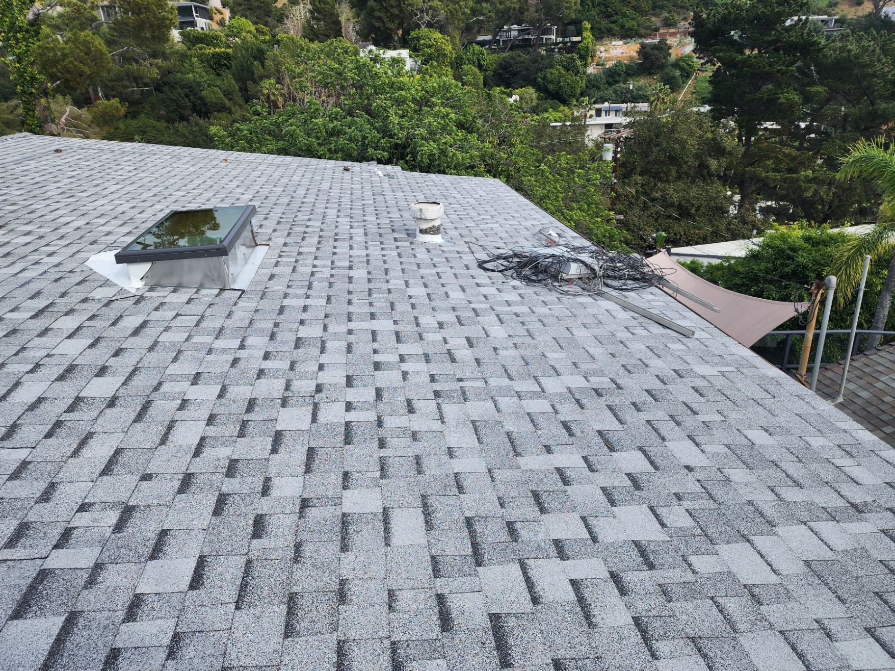 New composition shingle roof on a hillside Los Angeles home overlooking the canyon
