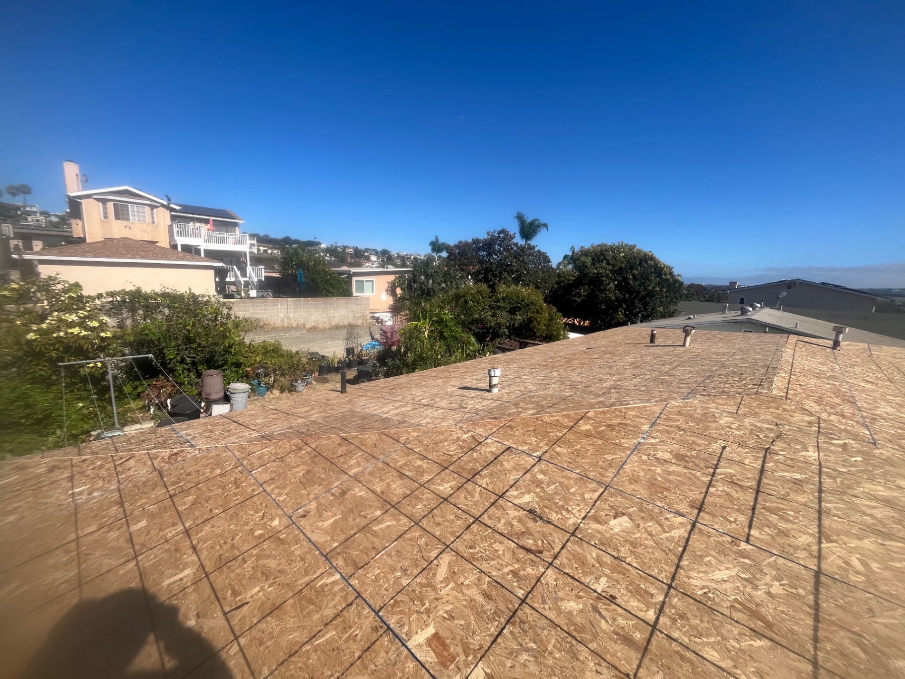 Roof deck with fresh vents and chalk lines on an LA hillside home