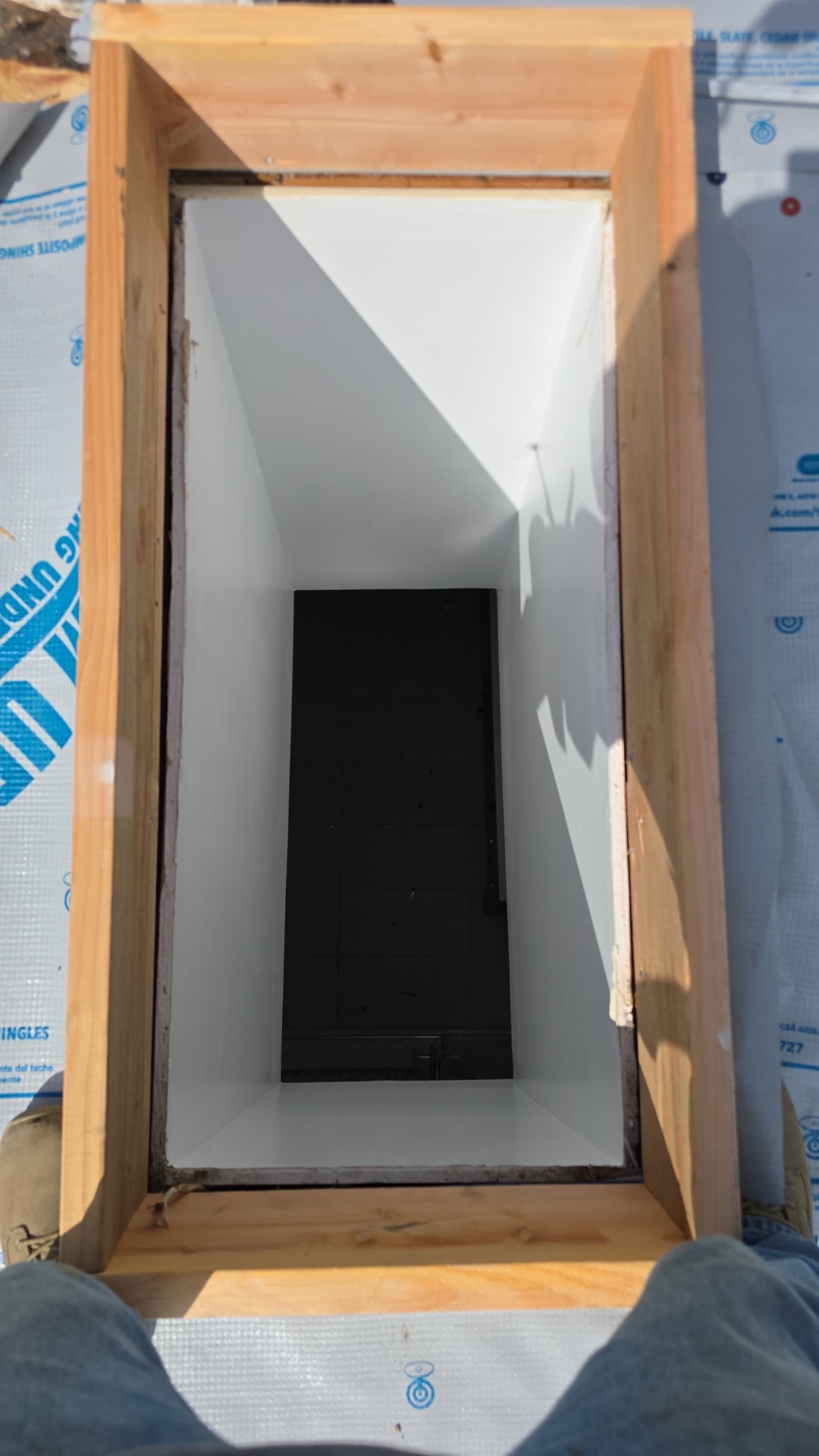 New skylight curb framed and dried-in on a Los Angeles roof
