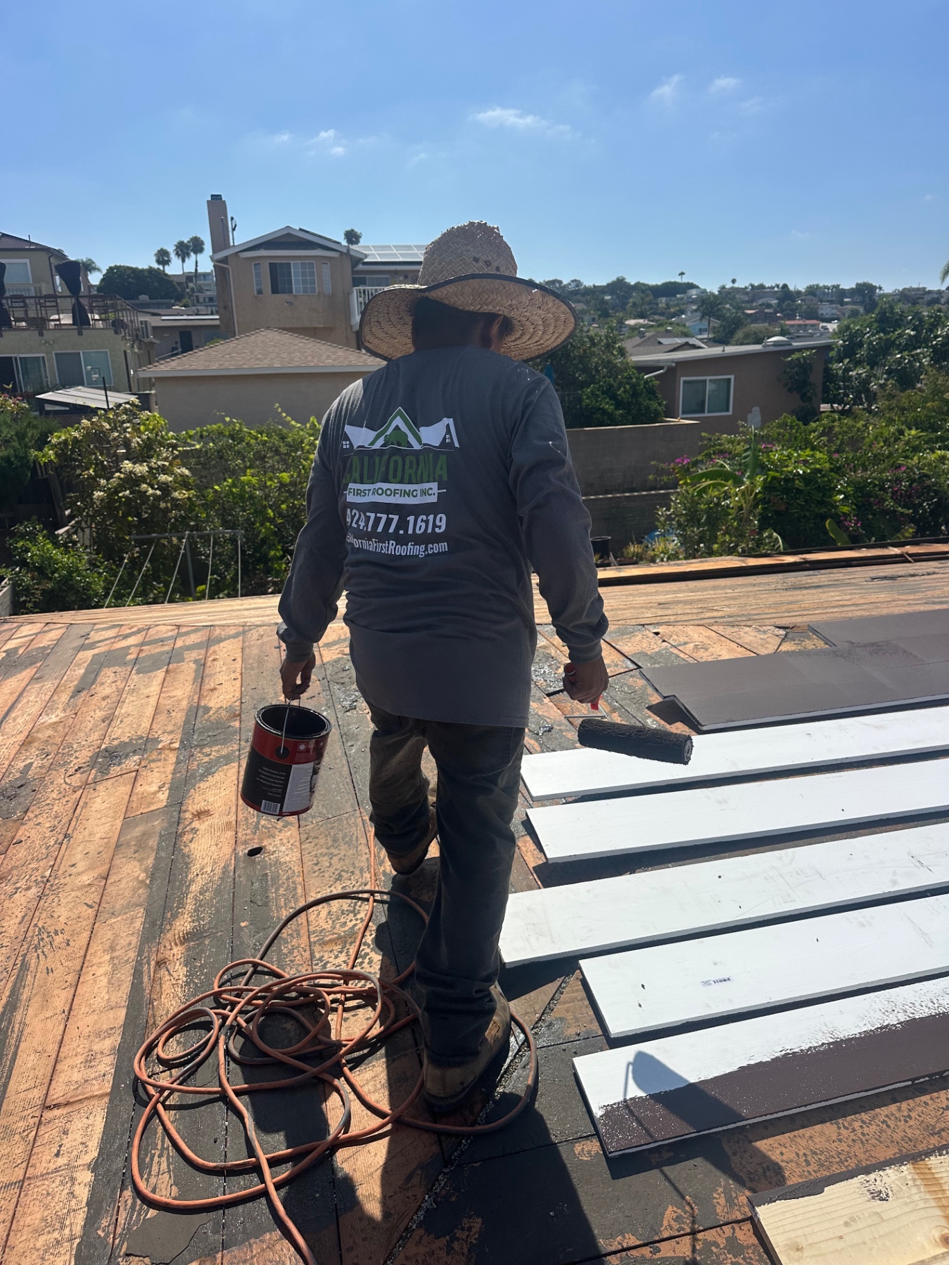 California First Roofing crew painting and prepping new roof decking