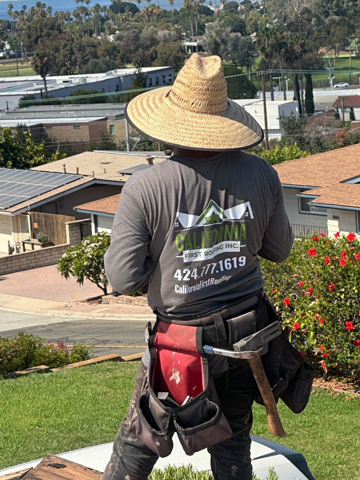 California First Roofing crew member on a Los Angeles job site overlooking the coast