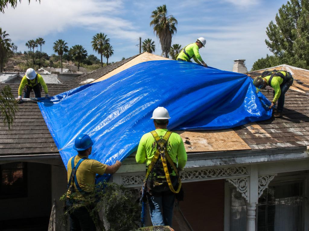 Emergency tarping crew responding to storm damage in Los Angeles